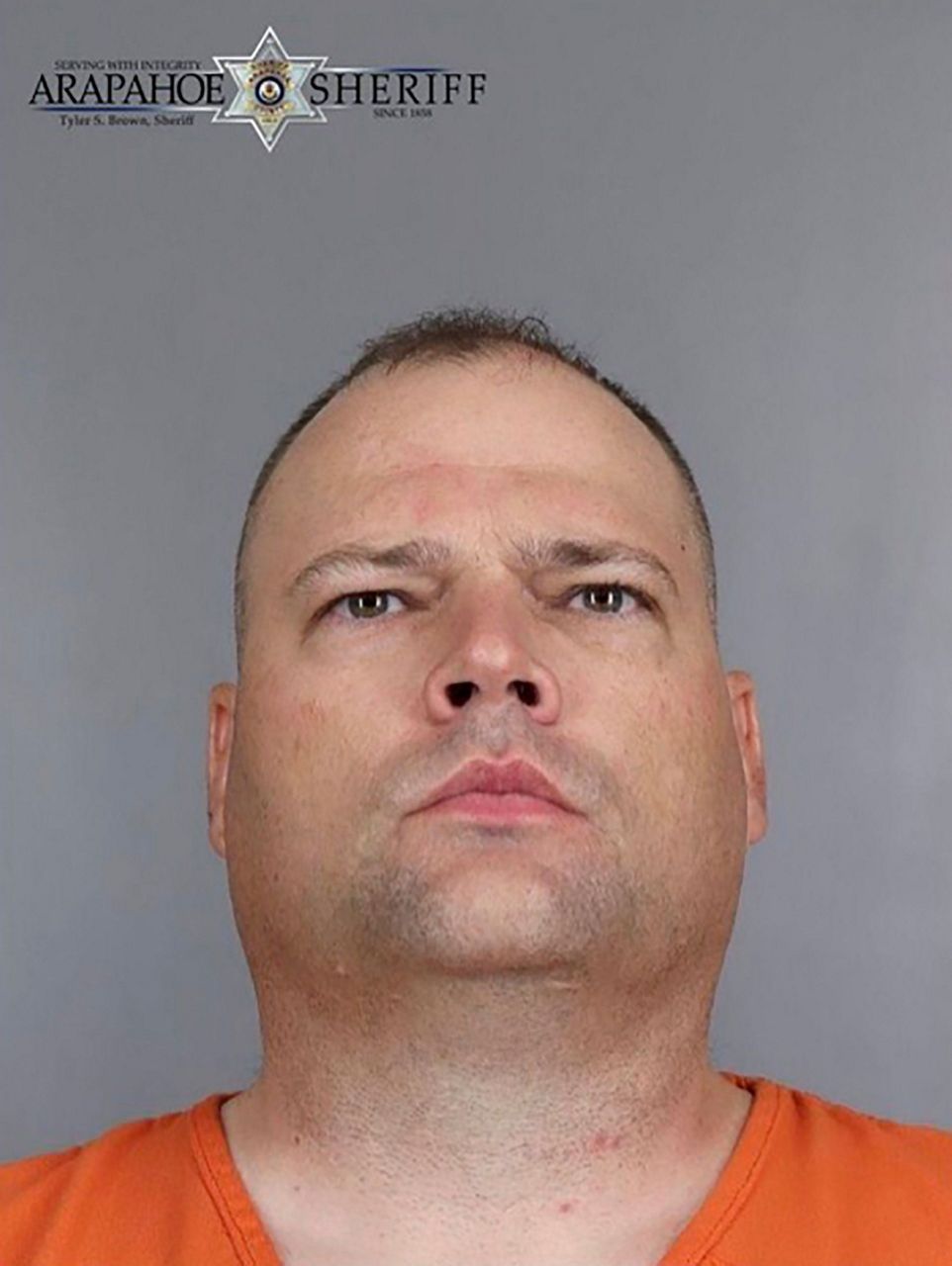 2 Colorado officers arrested after 1 hits suspect with gun