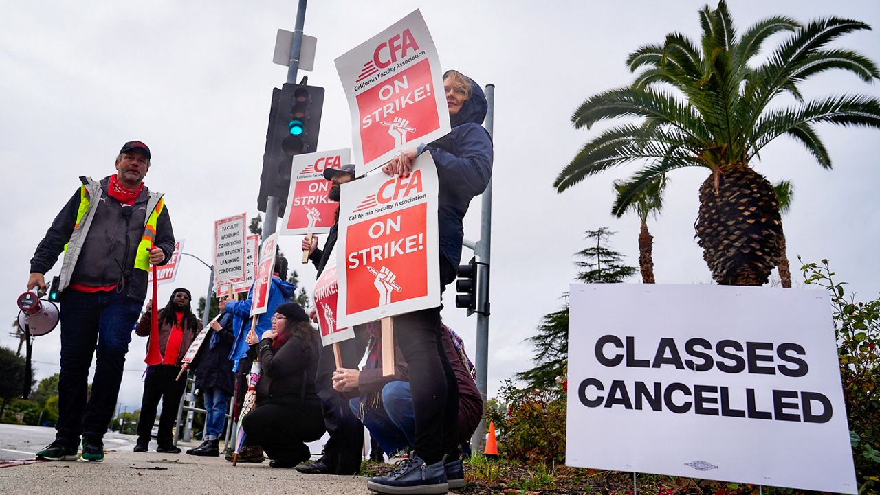 Demonstrators picket outside the Cal State Northridge campus Monday, Jan. 22, 2024, in Northridge, Calif. (AP Photo/Marcio Jose Sanchez)