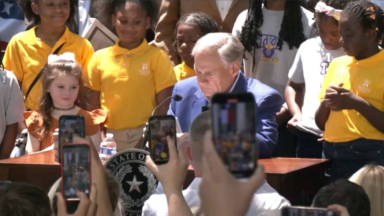 Texas Gov. Greg Abbott signs school voucher bill into law on Saturday, May 3, 2025. (Spectrum News 1/Erin Davis)