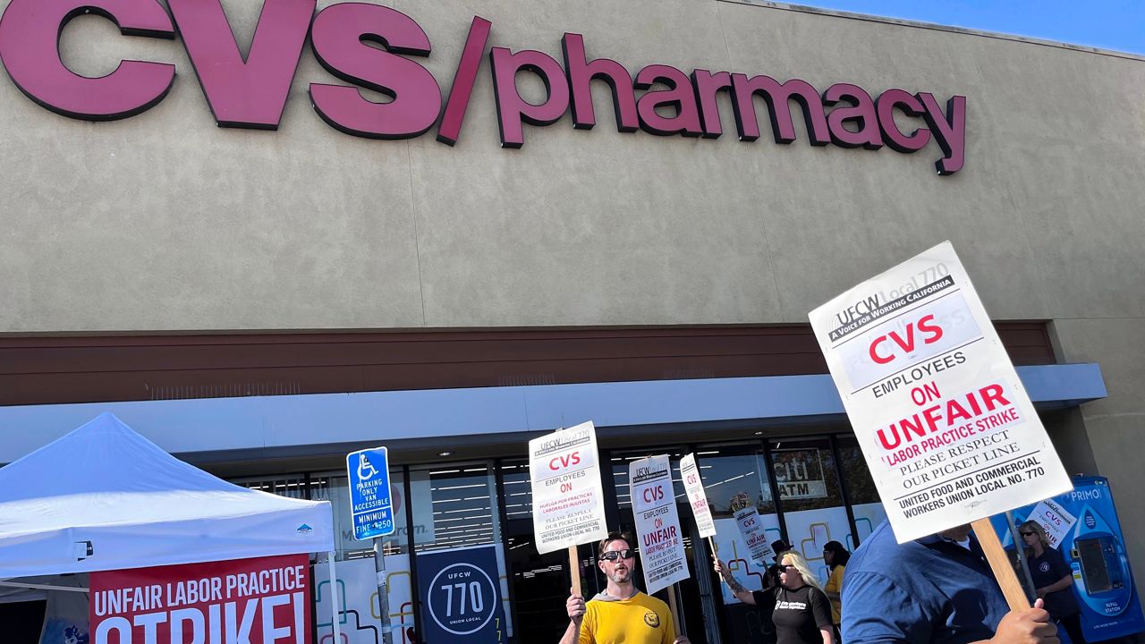 Workers on strike picket in front of a CVS pharmacy on Saturday, Oct. 19, 2024, in Los Angeles. (AP Photo/Jaimie Ding)