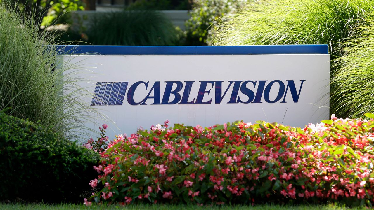 A sign is displayed at Cablevision headquarters in Bethpage, N.Y., on Sept. 17, 2015. (AP Photo/Seth Wenig, File)