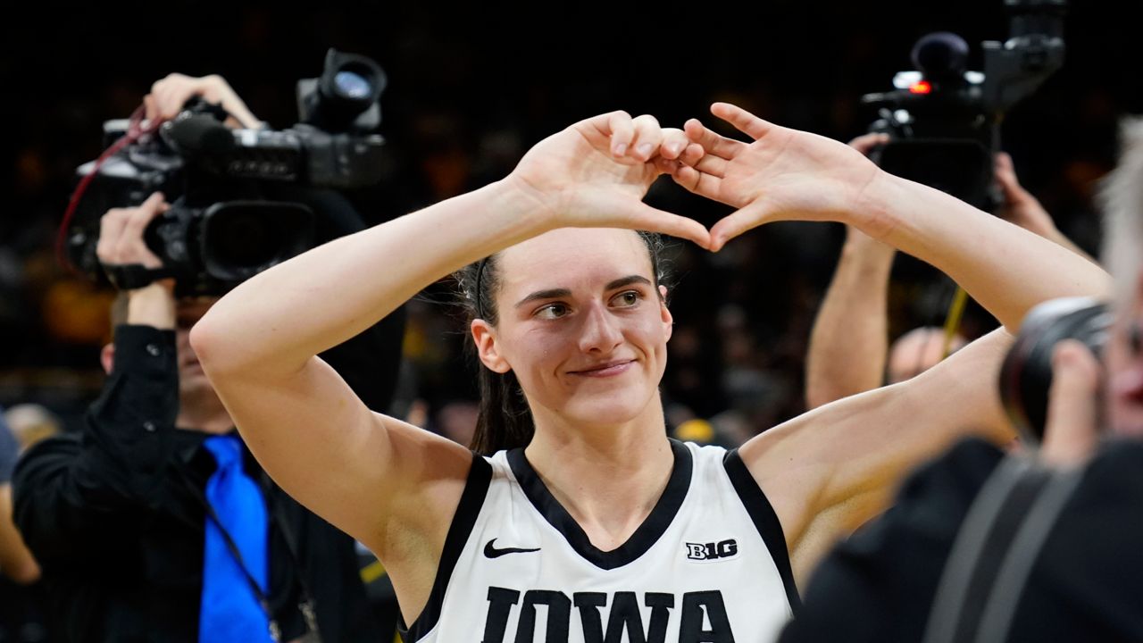 Iowa guard Caitlin Clark celebrates as she walks off the court after an NCAA college basketball game against Nebraska, Saturday, Jan. 27, 2024, in Iowa City, Iowa. Iowa won 92-73.