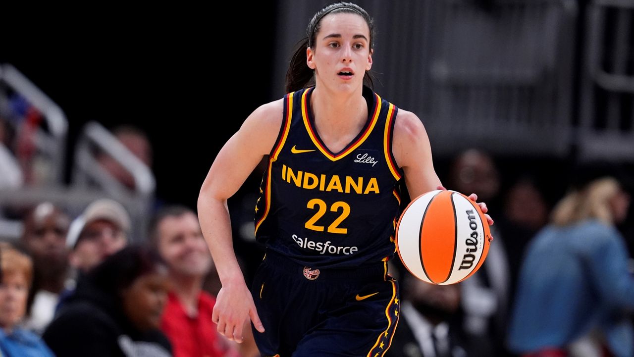 Indiana Fever's Caitlin Clark dribbles during the second half of a WNBA preseason basketball game against the Atlanta Dream, Thursday, May 9, 2024, in Indianapolis. (AP Photo/Darron Cummings)