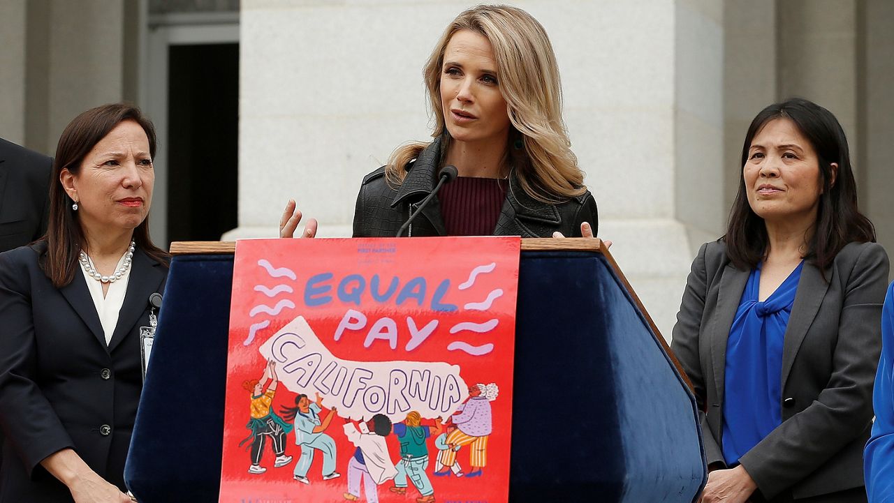 California First Partner Jennifer Siebel Newsom, center, the wife of Gov. Gavin Newsom, calls for equal pay for women during a news conference,Monday, April 1, 2019, in Sacramento, Calif. Siebel Newsom, along with Lt. Gov. Eleni Kounalakis, left, California Labor Secretary Julie, A. Su, right, and others, joined together to announce the #EqualPayCA campaign. (AP Photo/Rich Pedroncelli)