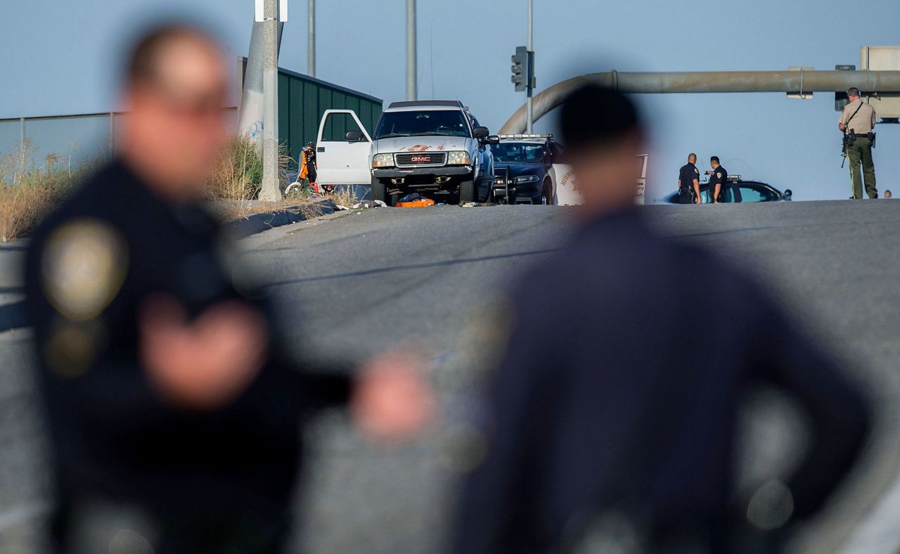 No motive after shootout kills California officer, gunman
