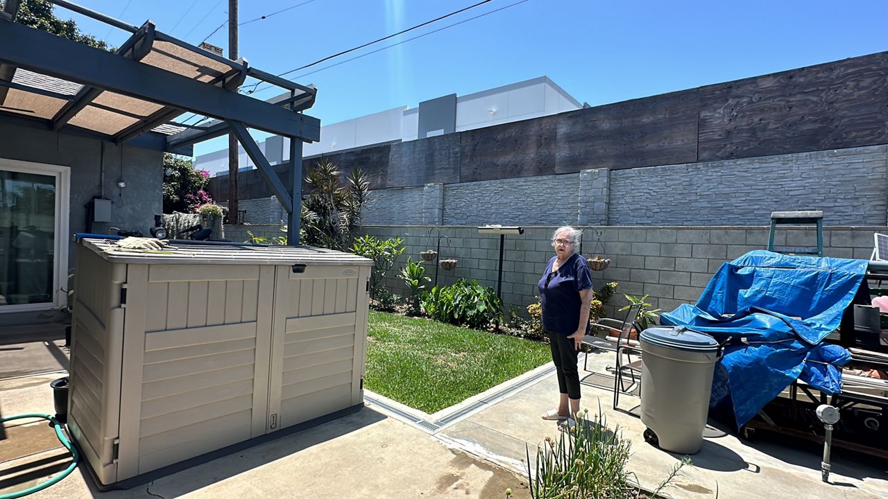 Torrance resident Jan Kalani, taking care of her garden which she had adjusted to make sure it is not contaminated. (Spectrum News/Vania Patino)