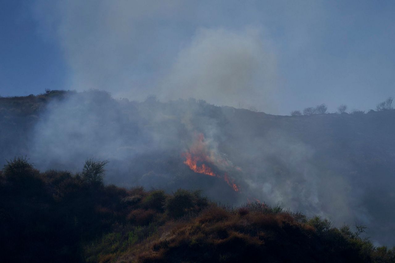 Northern California wildfire spreads, with more hot weather expected ...