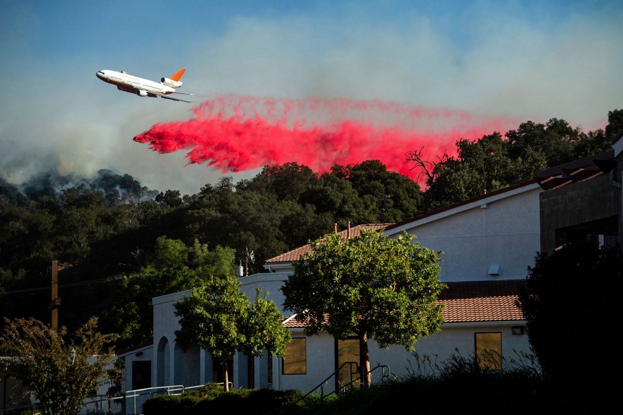 Latest: Winds ease as crews fight Southern California fire
