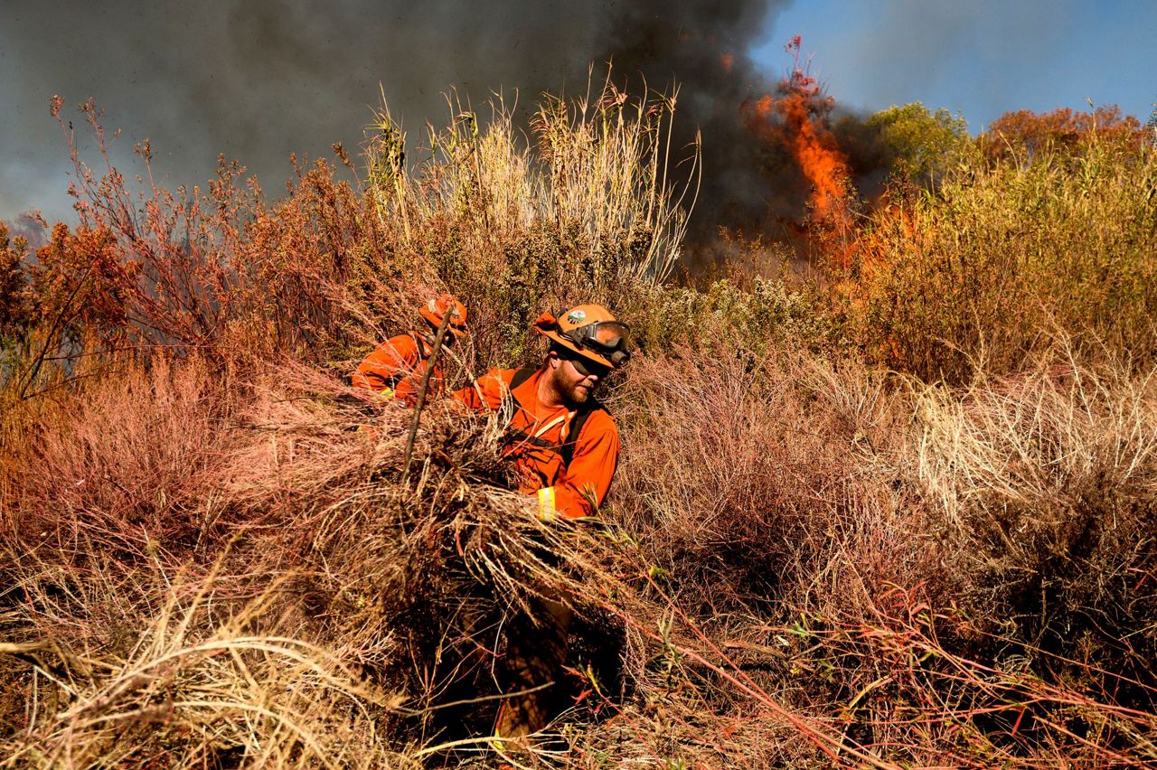 Not out of woods yet, but winds driving California fires die