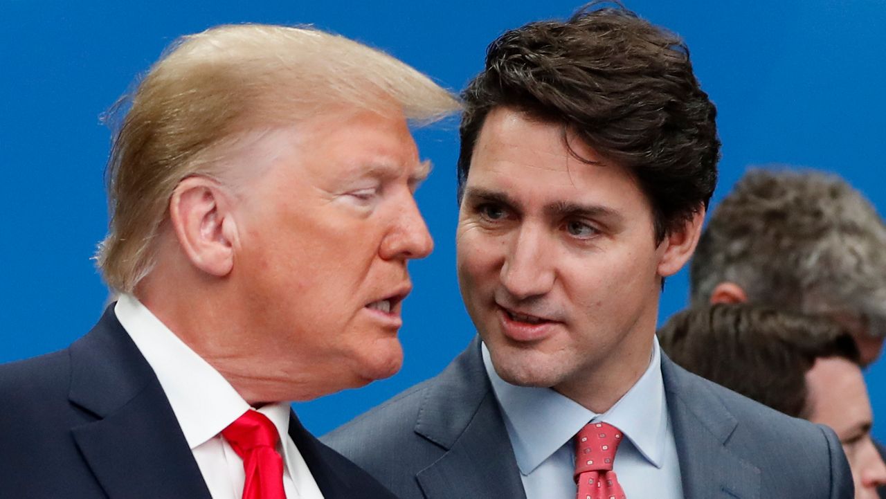 U.S. President Donald Trump, left, and Canadian Prime Minister Justin Trudeau talk prior to a NATO round table meeting at The Grove hotel and resort in Watford, Hertfordshire, England, Dec. 4, 2019. (AP Photo/Frank Augstein, File)