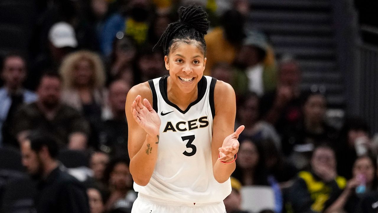 Las Vegas Aces forward Candace Parker reacts during the first half of a WNBA basketball game against the Seattle Storm, May 20, 2023, in Seattle. The three-time WNBA champion has announced she's retiring. Parker, a two-time league MVP, announced in a social media post on Sunday, April 28, 2024 that she's ending her career after 16 seasons. (AP Photo/Lindsey Wasson, File)