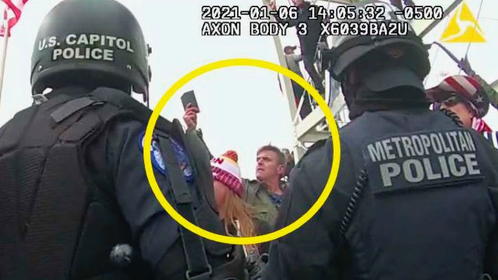 This image from Washington Metropolitan Police Department body-worn video, released and annotated by the Justice Department in the statement of facts supporting an arrest warrant for Jay James Johnston, shows Johnston, circled in yellow, at the U.S. Capitol on Jan. 6, 2021, in Washington. (Justice Department via AP)