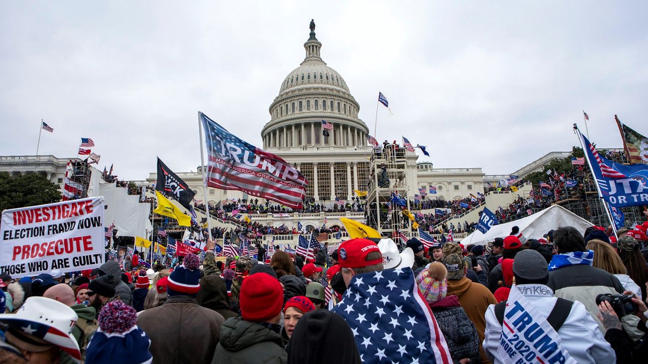Insurrectionists loyal to President Donald Trump storm the U.S. Capitol in Washington on Jan. 6, 2021. On Friday, May 5, 2023, a Kentucky man was sentenced to 14 years in prison, the longest punishment handed down so far in cases against Capitol rioters. (AP Photo/Jose Luis Magana)