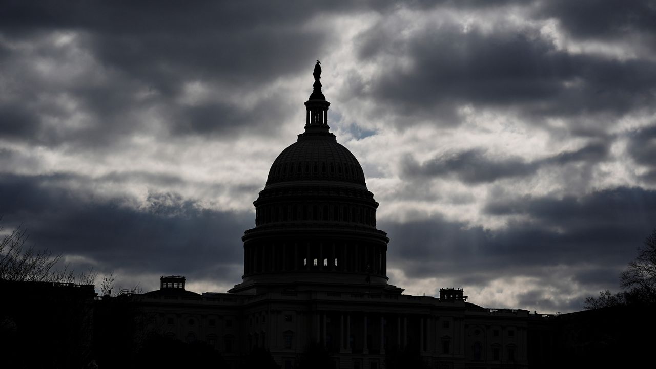 The Capitol in Washington, is framed by early morning clouds, Tuesday, March 19, 2024, as negotiators from Congress and the White House scramble to complete work on funding government agencies for the fiscal year and avoid a partial shutdown that could begin this weekend. (AP Photo/J. Scott Applewhite)
