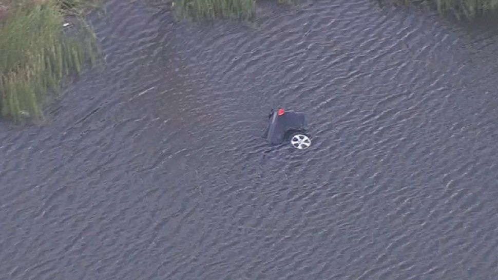 Pasco County Fire Rescue is on scene of a car into the water an the intersection of SR 54 and Gateway Blvd. in Wesley Chapel. (Spectrum Bay News 9)