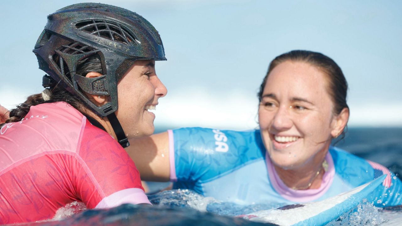 Moore loses as Olympic surfing competition resumes