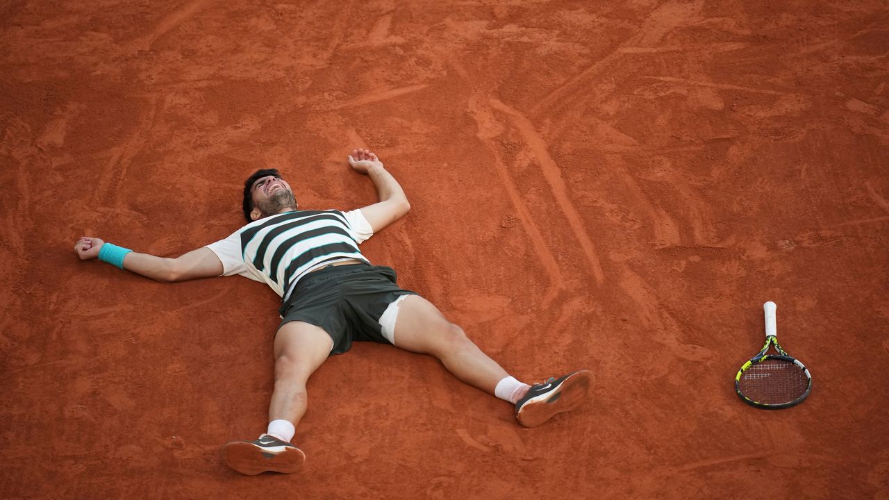 Spain's Carlos Alcaraz creacts after winning the final match of the French Tennis Open at the Roland-Garros against Italy's Jannik Sinner in Paris, Sunday, June 8, 2025. (AP Photo/Christophe Ena)