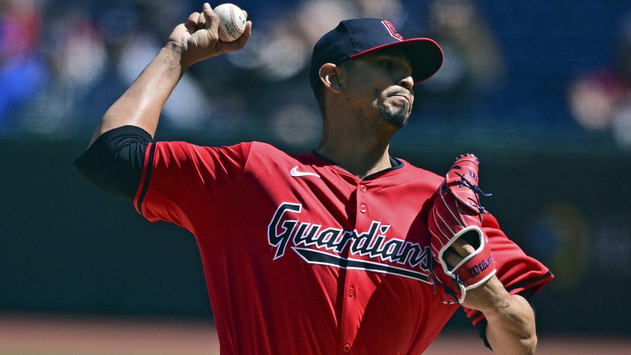 Cleveland Guardians starting pitcher Carlos Carrasco delivers during the first inning in the first baseball game of a doubleheader against the New York Yankees, Saturday, April 13, 2024, in Cleveland. (AP Photo/David Dermer)