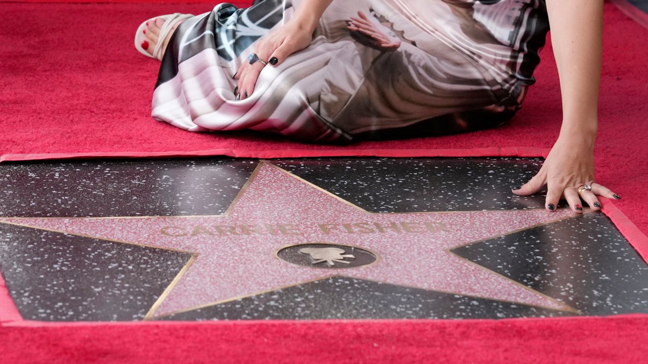 Fisher's star on the Hollywood Walk of Fame during a posthumous ceremony in Los Angeles on Thursday, May 4, 2023. The day is also known as May the Fourth in tribute to the "Star Wars" films in which Fisher played Princess Leia. (AP Photo/Chris Pizzello)