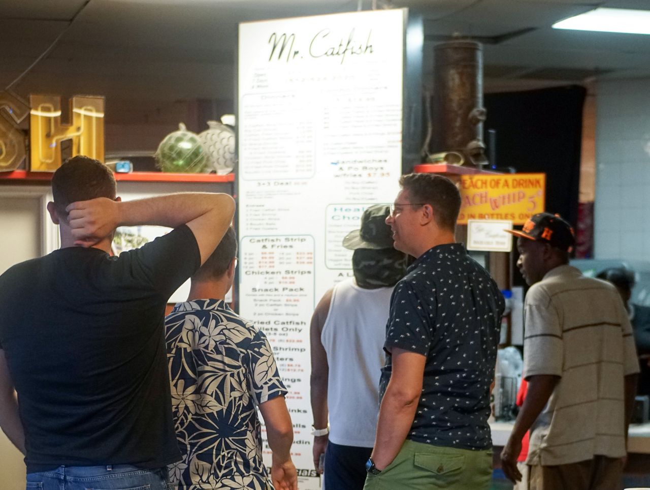 People browsing the Mr. Catfish menu