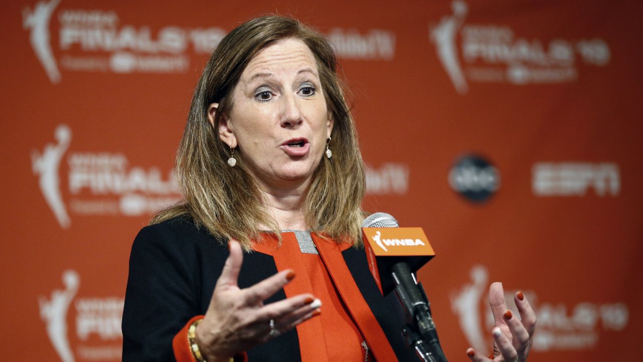 WNBA Commissioner Cathy Engelbert speaks at a news conference before Game 1 of basketball's WNBA Finals between the Connecticut Sun and the Washington Mystics, Sunday, Sept. 29, 2019, in Washington. (AP Photo/Patrick Semansky, File)