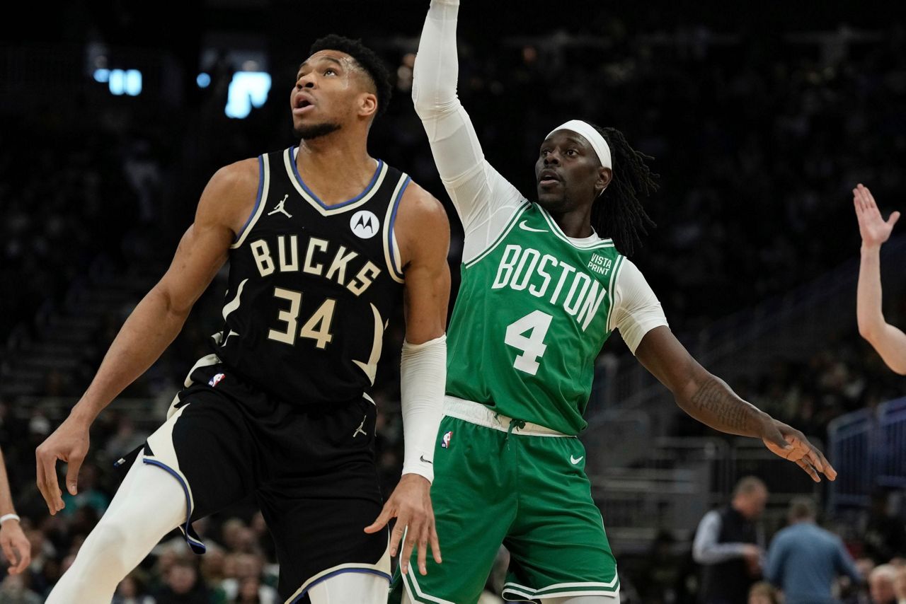 Antetokounmpo leaves Bucks' game with Celtics after grabbing his left ...