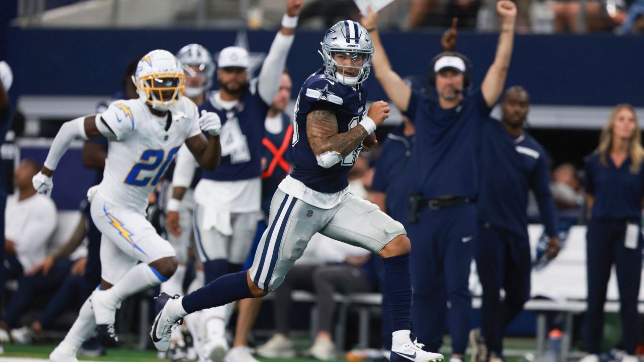 Dallas Cowboys quarterback Trey Lance runs for a touchdown during the second half of a preseason NFL football game against the Los Angeles Chargers, Saturday, Aug. 24, 2024, in Arlington, Texas.(AP Photo/Gareth Patterson)