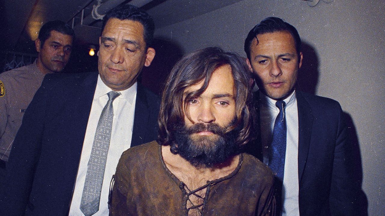 Charles Manson is escorted to his arraignment on conspiracy-murder charges in connection with the Sharon Tate murder case in Los Angeles in 1969. Leslie Van Houten, one of Manson's followers, was released from prison on parole on Tuesday, July 11, 2023. (AP Photo/File)