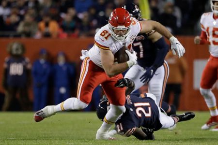 Kansas City Chiefs quarterback Patrick Mahomes (15) runs for a 12-yard  touchdown against the Chicago Bears in the first half of an NFL football  game in Chicago, Sunday, Dec. 22, 2019. (AP