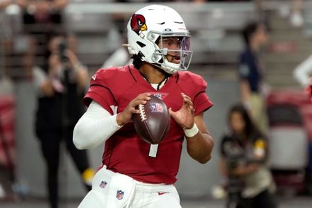 Kansas City Chiefs quarterback Patrick Mahomes (15) tries to elude Arizona  Cardinals cornerback Malcolm Butler (21) during the first half of an NFL  football game, Friday, Aug. 20, 2021, in Glendale, Ariz. (