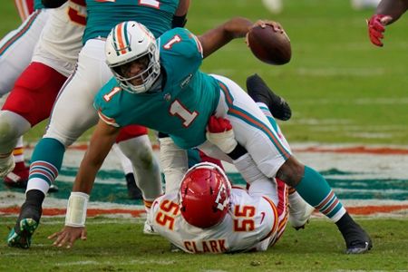 Miami Dolphins tight end Mike Gesicki (88) deflects the ball as