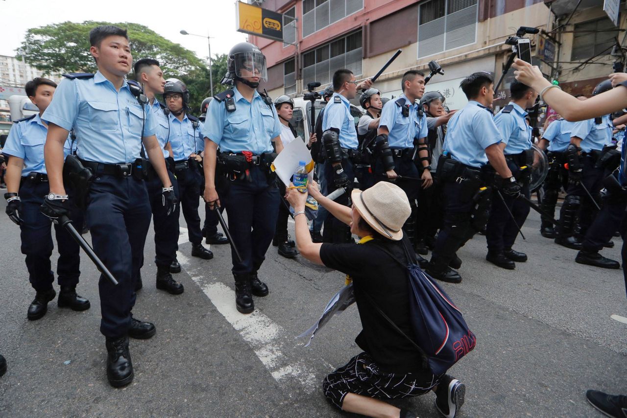 China waiting out Hong Kong protests, but backlash may come