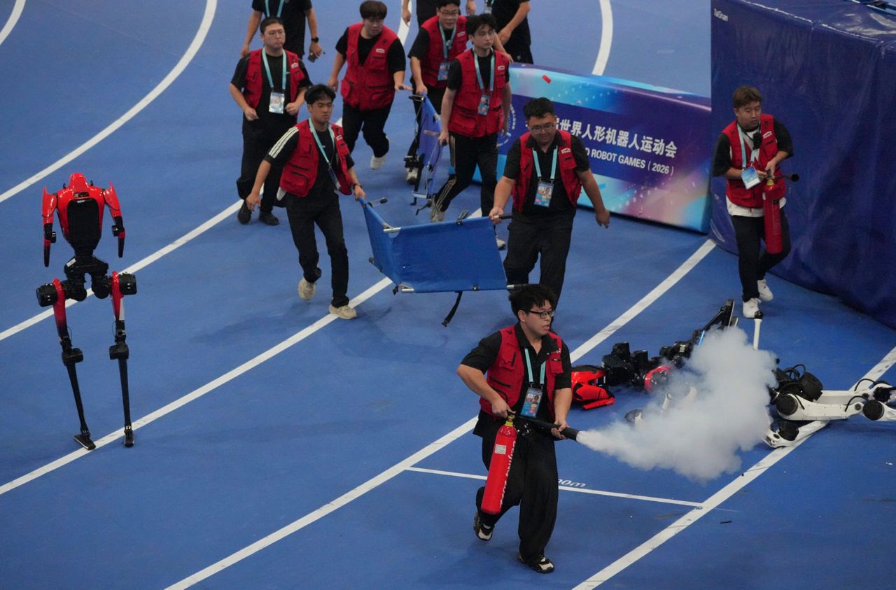 A robot sprinter shatters a 100-meter record again as sparks fly at ...