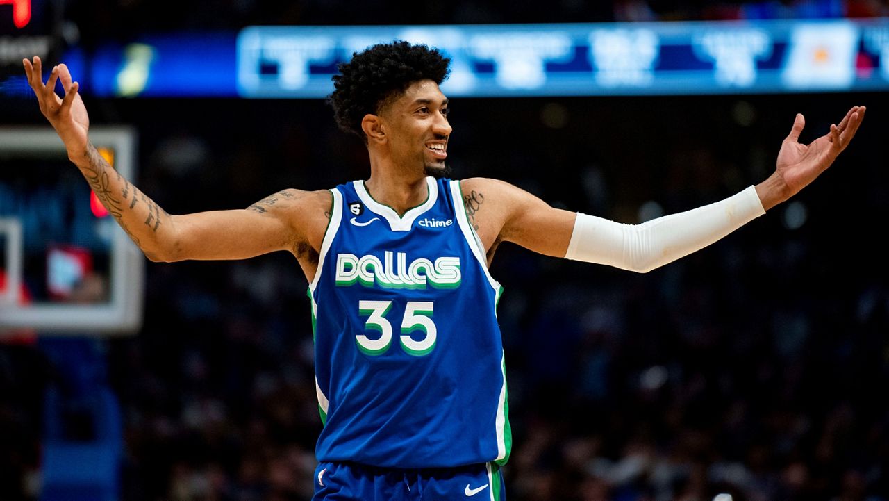 Dallas Mavericks forward Christian Wood (35) gestures to the crowd after scoring in the second half of an NBA basketball game against the Los Angeles Lakers in Dallas, Sunday, Dec. 25, 2022. (AP Photo/Emil T. Lippe)