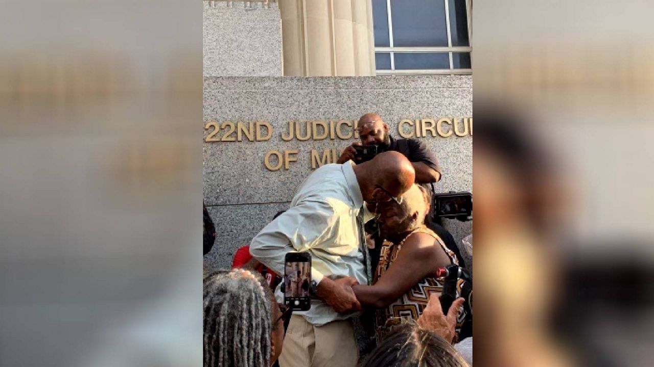 Christopher Dunn is reunited with his mother Martha at the Carnahan Courthouse in downtown St. Louis Tuesday night following his release from custody. Dunn's 1990 murder conviction was vacated last week by a St. Louis judge but Dunn's release was held up by an appeal to the state supreme court. The high court ruled earlier Tuesday that Dunn could not be held in state custody after the circuit court's ruling to vacate the conviction. (Courtesy: Midwest Innocence Project)