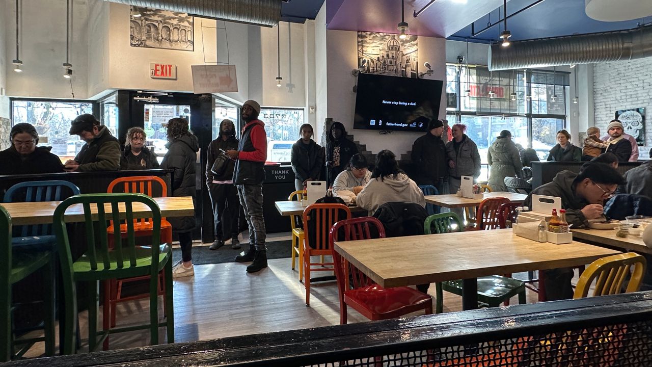 Customers pack inside of restaurant around lunch hour, celebrating Dia del Cilantro.