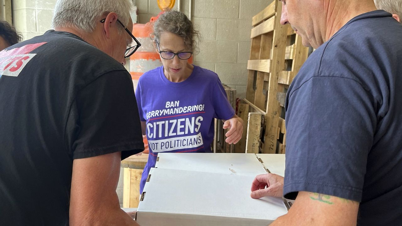 Volunteers with Citizens Not Politicians load boxes of signed petitions to Secretary of State Frank LaRose's office on Monday, July 1, 2024, in Columbus, Ohio. Backers of a proposal to change Ohio's troubled political mapmaking system delivered hundreds of thousands of signatures on Monday as they work to qualify for the statewide ballot this fall. (AP Photo/Patrick Orsagos)
