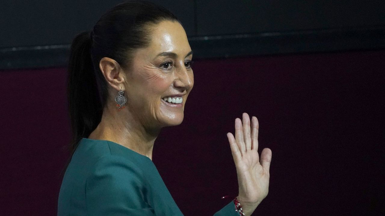 Incoming President Claudia Sheinbaum waves at the end of a press conference where she presented four more members of her Cabinet, in Mexico City, July 4, 2024. (AP Photo/Marco Ugarte, File)