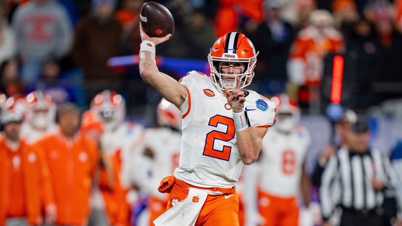 Clemson quarterback Cade Klubnik (2) drops back to pass during the Atlantic Coast Conference championship NCAA college football game between Clemson and SMU Saturday, Dec. 7, 2024, in Charlotte, N.C. (AP Photo/Jacob Kupferman)