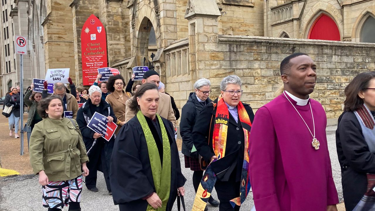 Clergy who filed suit seeking to overturn Missouri's abortion law and other opponents of the law hold a March through downtown St. Louis on Thursday, Jan. 19, 2023. A St. Louis judge on Thursday, Nov. 16, 2023 will hear arguments in a lawsuit challenging Missouri's abortion ban on the grounds that lawmakers who passed the measure imposed their own religious beliefs on others who don't share them. The lawsuit was filed in January on behalf of 13 Christian, Jewish and Unitarian Universalist leaders who support abortion rights. (AP Photo/Jim Salter, File)