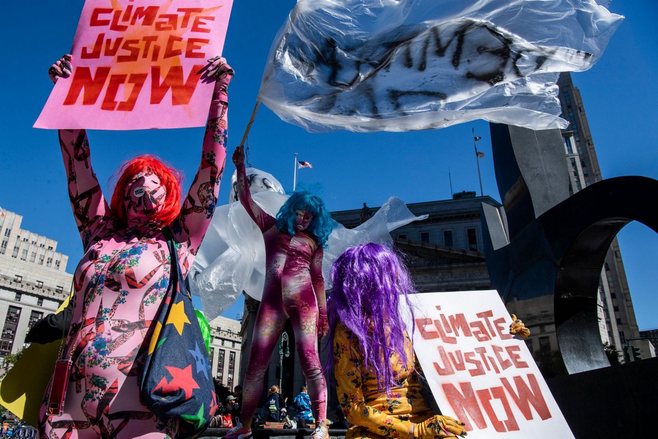Protesters fear climate change impacts, demand aid for poor