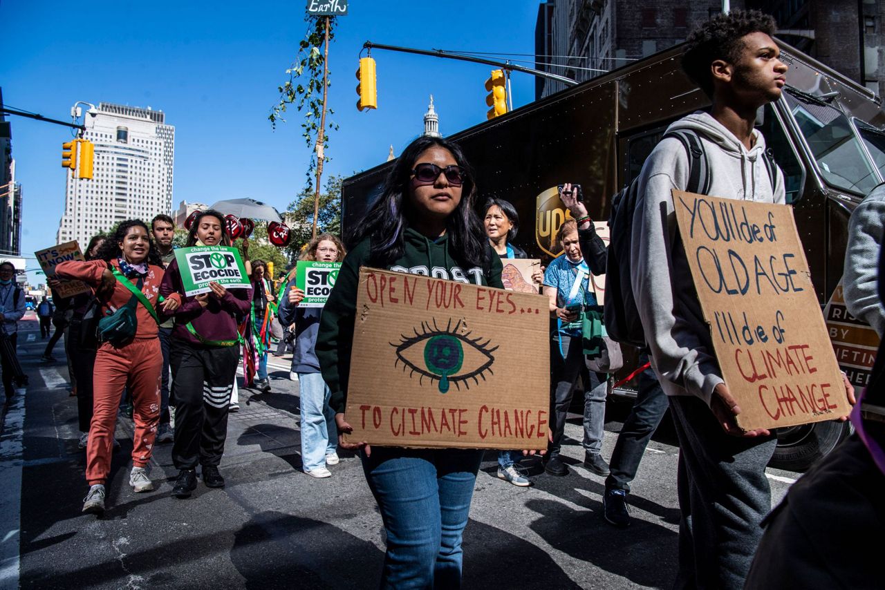 Protesters fear climate change impacts, demand aid for poor