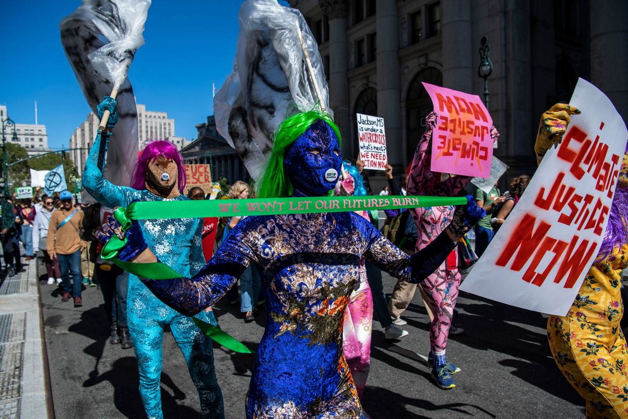 Protesters fear climate change impacts, demand aid for poor