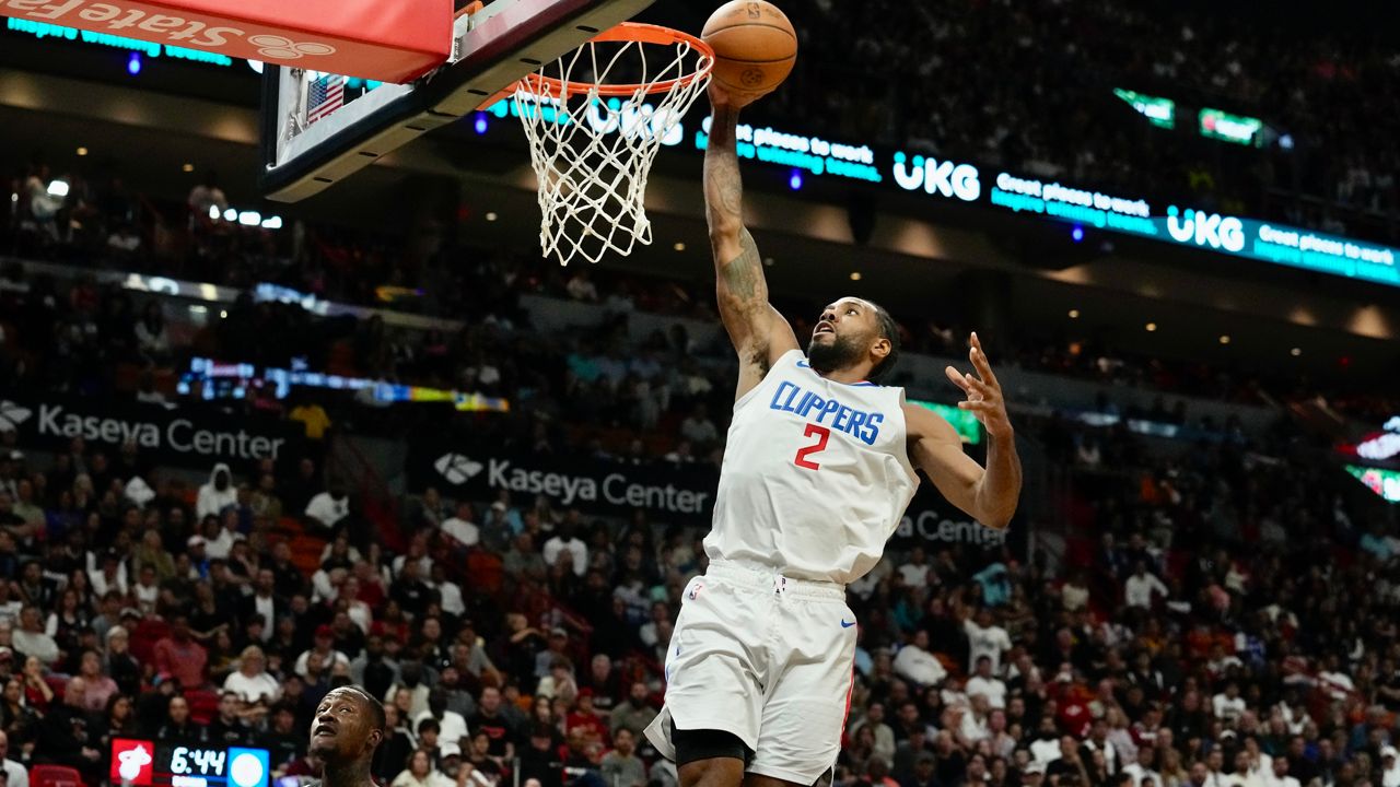 Los Angeles Clippers forward Kawhi Leonard (2) dunks the ball during the second half of an NBA basketball game against the Miami Heat, Sunday, Feb. 4, 2024, in Miami. (AP Photo/Marta Lavandier)