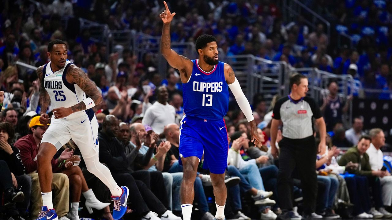 LA Clippers forward Paul George (13) celebrates after making a 3-pointer during the first half of Game 1 of an NBA basketball first-round playoff series against the Dallas Mavericks in Los Angeles, Sunday, April 21, 2024. (AP Photo/Ashley Landis)