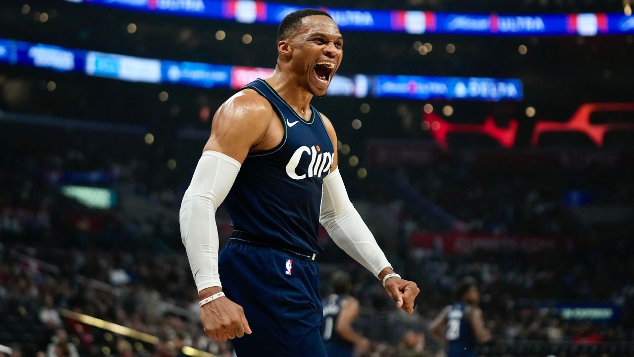 Los Angeles Clippers guard Russell Westbrook celebrates on the court after dunking during the first quarter of an NBA basketball gam against the Memphis Grizzlies in Los Angeles, Friday, Dec. 29, 2023. (AP Photo/Damian Dovarganes)