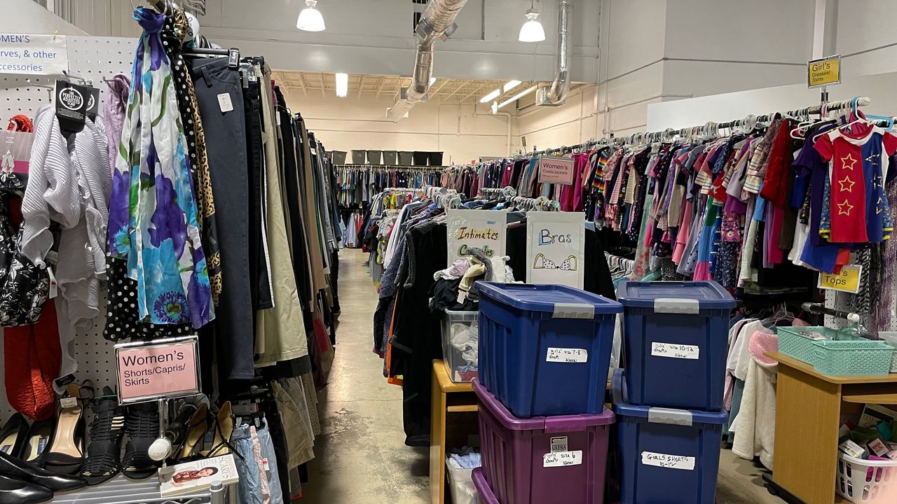 The CAP warehouse is filled from floor to celling with new and gently used clothes. (Spectrum News 1/Mason Brighton)
