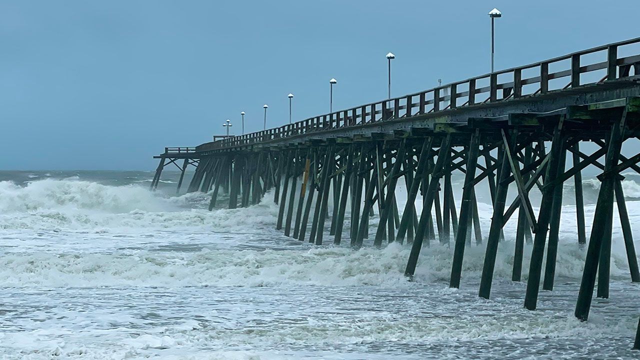 Rough surf by the pier from Hurricane Ian