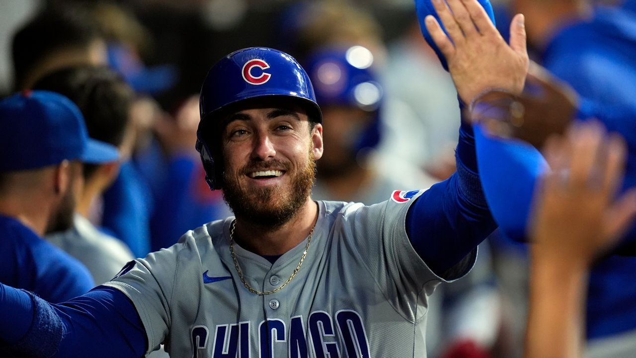 FILE - Chicago Cubs' Cody Bellinger celebrates after scoring on a home run by Isaac Paredes during the third inning of a baseball game against the Chicago White Sox, Friday, Aug. 9, 2024, in Chicago. (AP Photo/Erin Hooley, File)