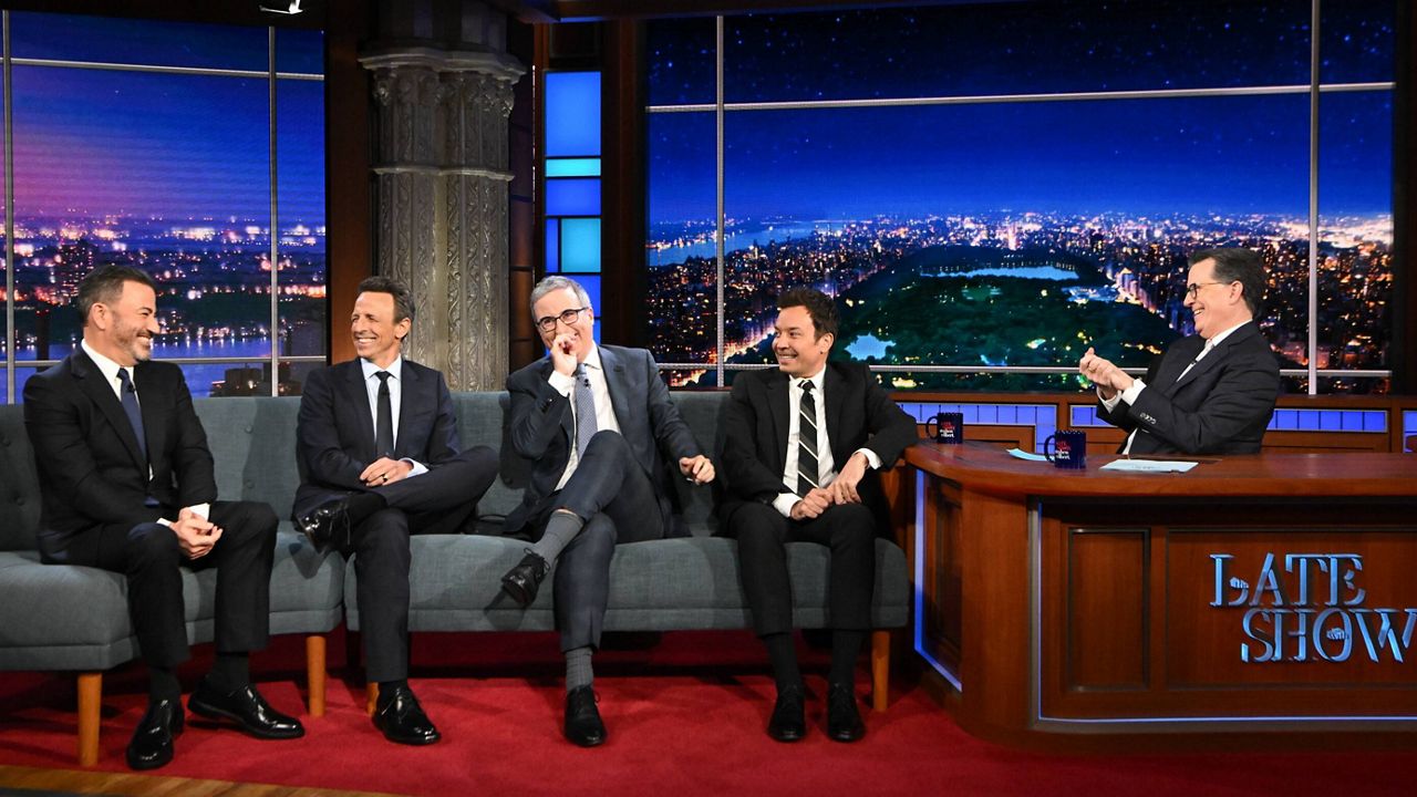 This image released by CBS shows host Stephen Colbert, right, with guests, from left, Jimmy Kimmel, Seth Meyers, John Oliver and Jimmy Fallon on "The Late Show with Stephen Colbert" in New York on May 11, 2026. (Scott Kowalchyk/CBS via AP)